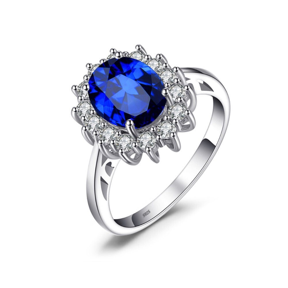 Anel oval zircônia azul safira cravejado prata 925